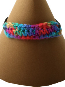 Multi-coloured adjustable bracelet. Tapestry crochet and black chord, adjustable length 16 - 21 cm