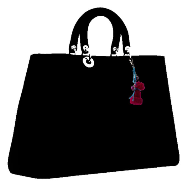 crimson hat charm on drawing of a bag